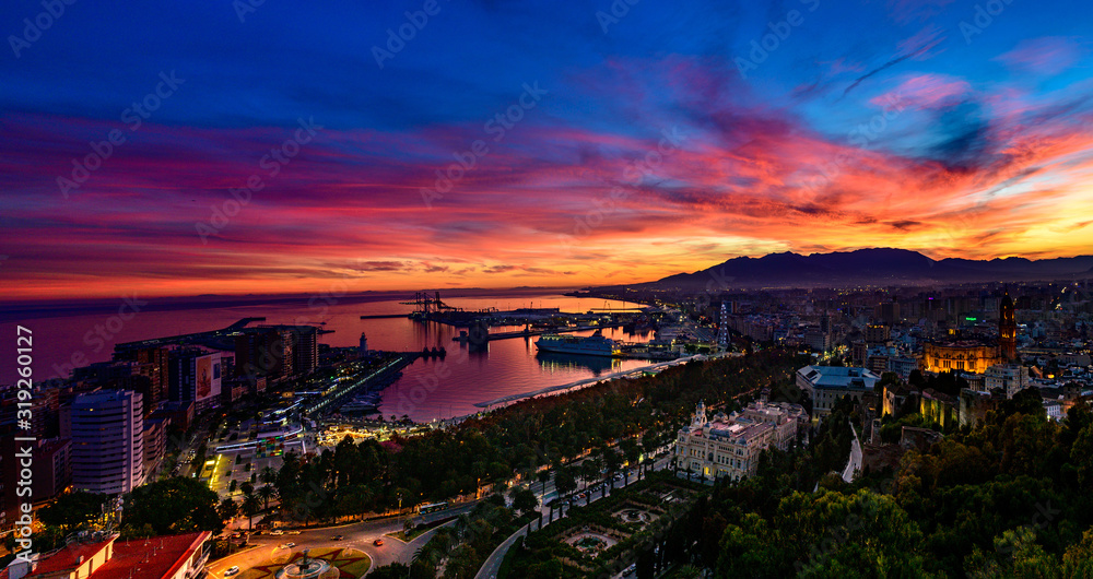 a dramatic, colorful sky above Malaga