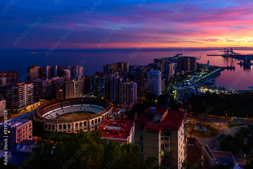 a dramatic, colorful sky above Malaga