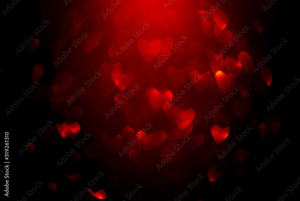 Fototapeta Background with red bokeh in the shape of a heart.