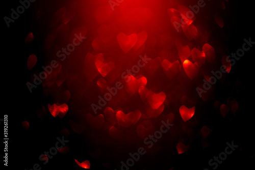 Background with red bokeh in the shape of a heart.