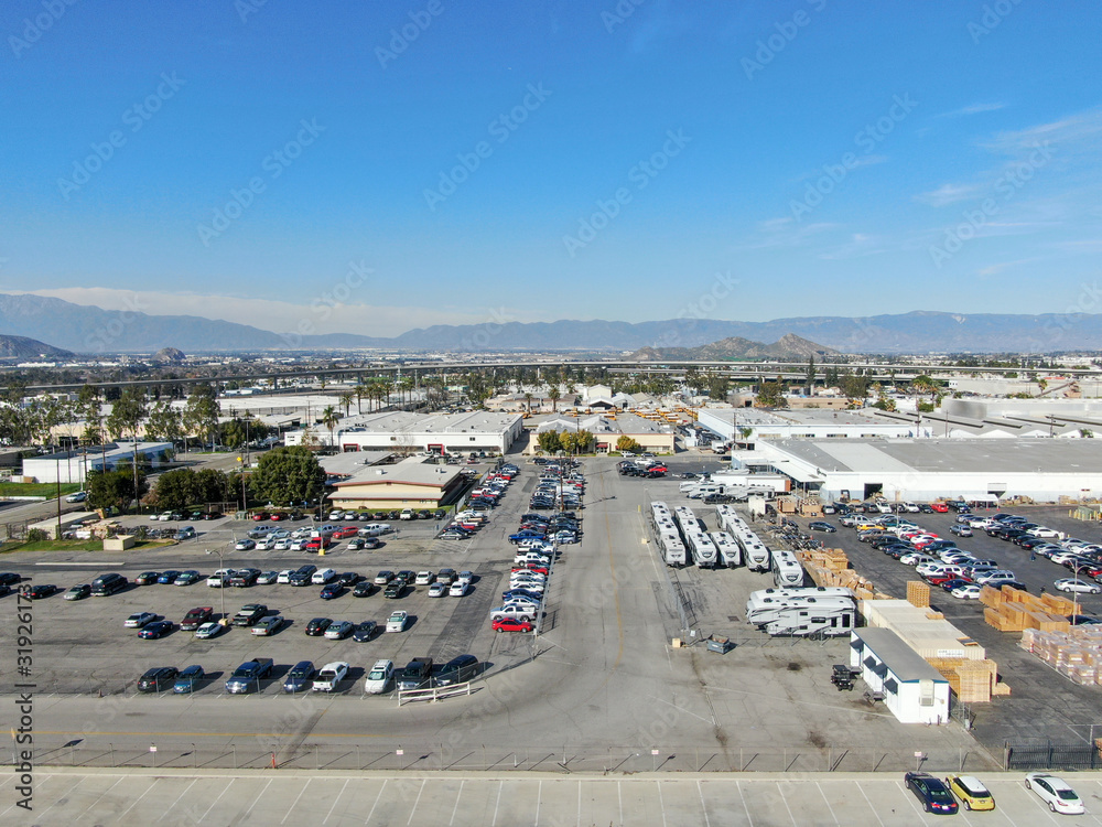 Aerial view to industrial zone and company storage warehouse in RIverside, California, USA