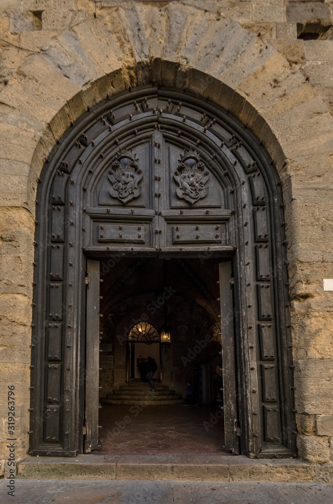 Fototapeta premium Entrance door of the Palazzo dei Priori in Volterra