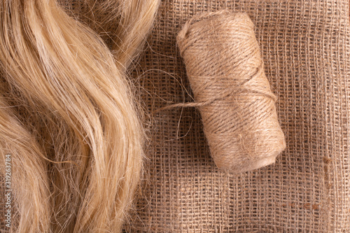 Products from flax. Linen fabric, linseed oil, tow and a coil of flaxseed.