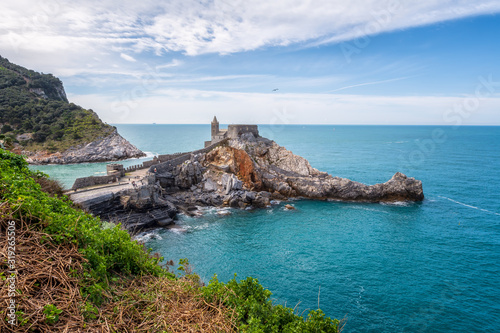 Beautiful aerial view with the Church of St. Peter (Chiesa di San Pietro) at the rocky coastline of Portovenere, Italy.
