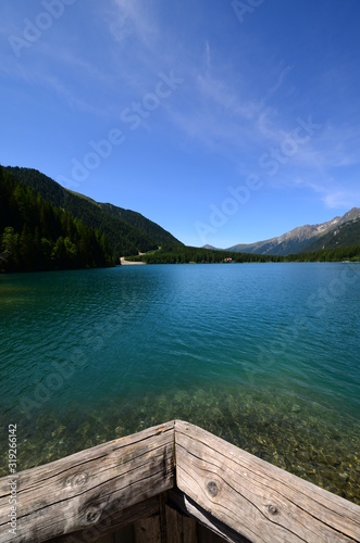Spectacular scenic view of Antholzer See (Italian: Lago di Anterselva) a beautiful turquoise colored lake in South Tyrol, Italy.