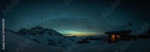 Принти на полотні Evening mood in a lonely mountain hut in the Austrian Alps, summit of the Breith