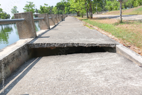 Concrete road with cracks With the shadow of the sunlight