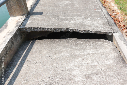 Concrete road with cracks With the shadow of the sunlight