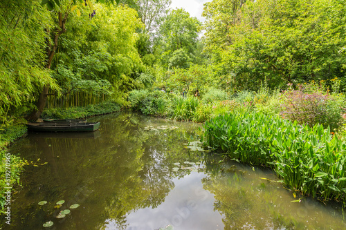 Giverny  France. Scenic boat in a pond in the park of the artist Claude Monet