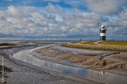 lighthouse on the coast with tideway