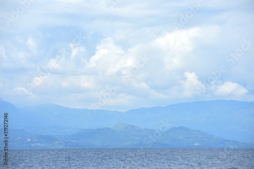 Ocean Water Horizon And Cloudy Sky