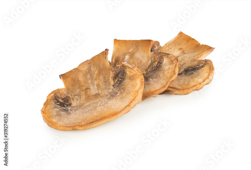 Roasted sliced champignons isolated on white background. Mushrooms. Top view.