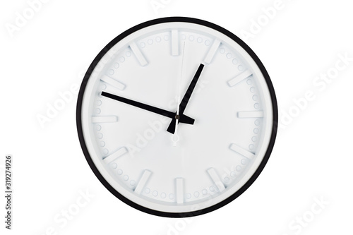 Wall clock with a white dial and black arrows isolated on a white background.