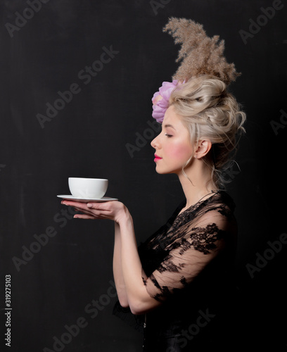 Beautiful blonde countess with a cup of tea