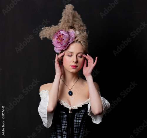 Beautiful blonde countess on dark