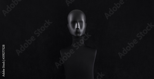 black mannequin head isolated on black background photo
