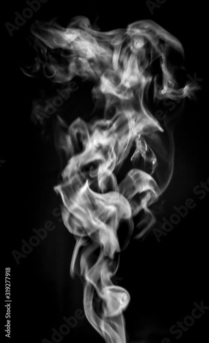 Smoke or steam on black isolated background for insertion image in overlay mode_