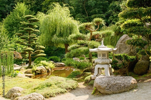 Beautiful decorative japanese garden in summer time photo