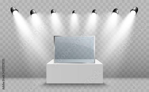 Glass showcase for the exhibition in the form of a cube. Background for sale illuminated by spotlights. Museum glass box isolated advertising or business design boutique. Exhibition hall.