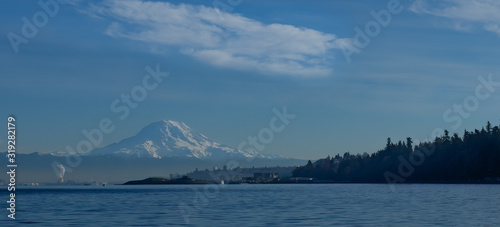 Panorama of Mt. Rainier with Tacoma Washington and Pt Defiance Park in foreground taken from Puget Sound