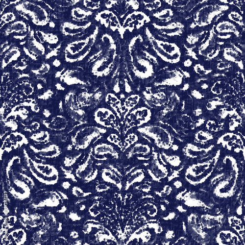 Damask indigo dyed effect distressed worn bleached graphical motif. Noisy brushed faded mottled, intricate grungy stained navy design. Seamless repeat vector eps 10 pattern swatch.