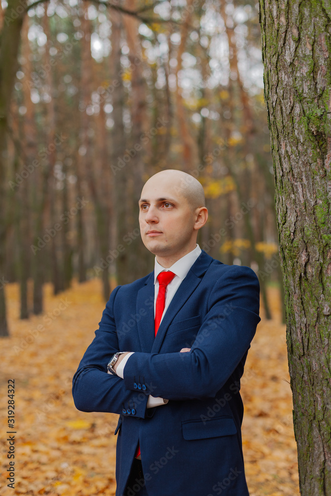 Handsome stylish man in a jacket in the autumn in the forest. Handsome stylish man in a jacket in the autumn in the forest.