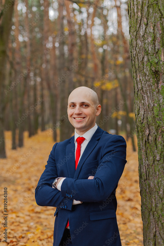 Handsome stylish man in a jacket in the autumn in the forest. Handsome stylish man in a jacket in the autumn in the forest.