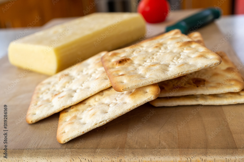 Crackers with cheese in the background