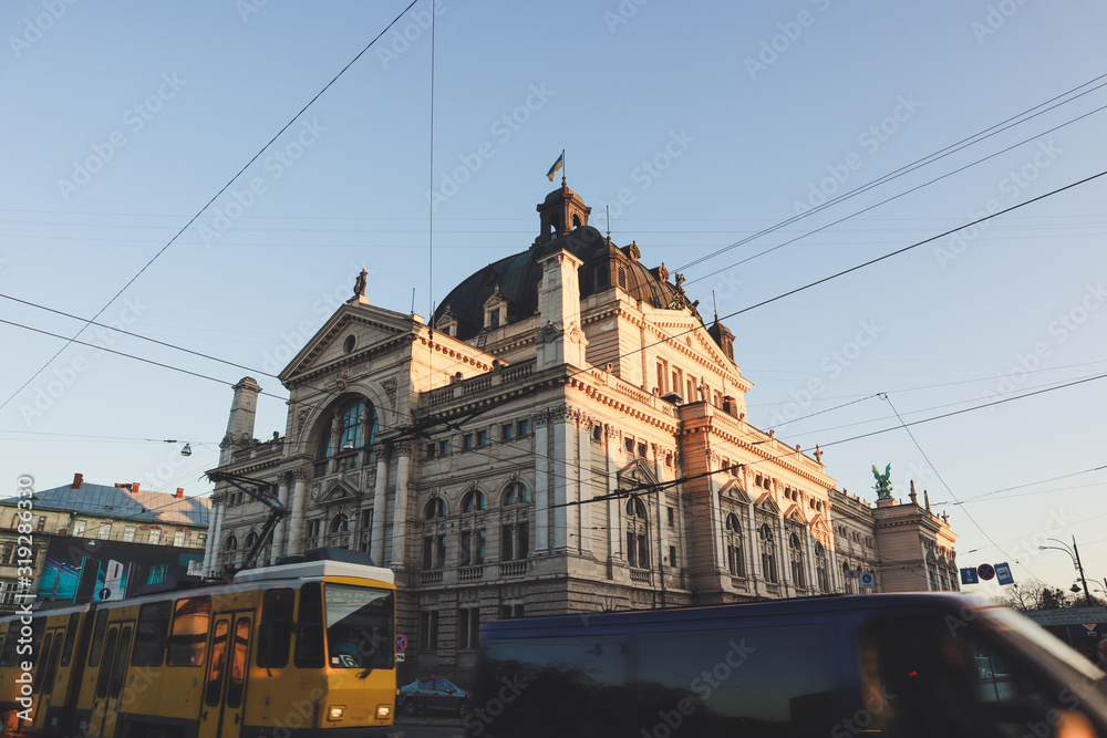 Opera house and yellow tram.Old streets of Lviv. Austrian architecture. City details. The atmosphere of Leopolis.