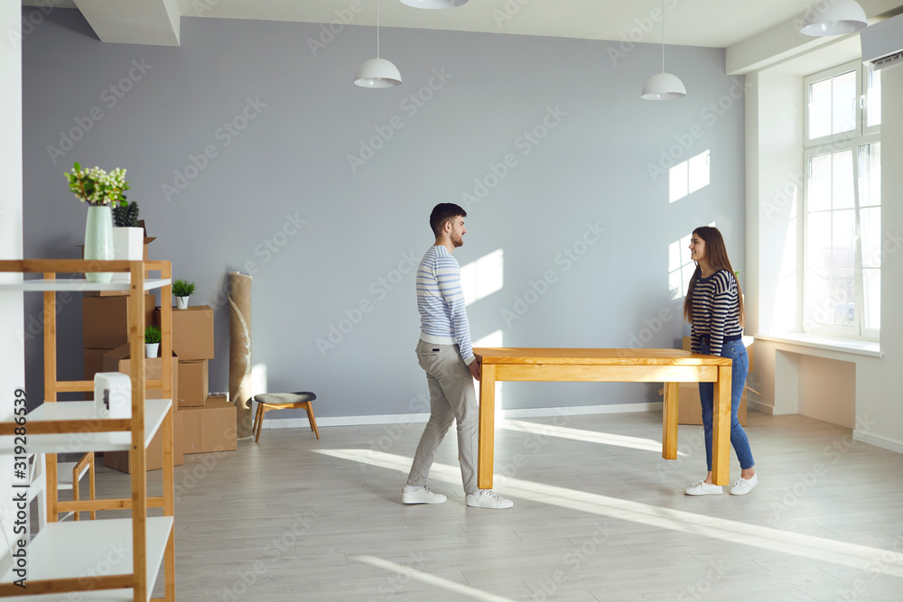 Young couple family with boxes to move in a new house room. Young couple family with boxes to move in a new house room.