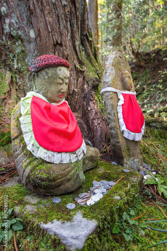 Jizo Statue in Ancient Graveyard of Okunoin Cemetery, Koyasan, Japan. photo