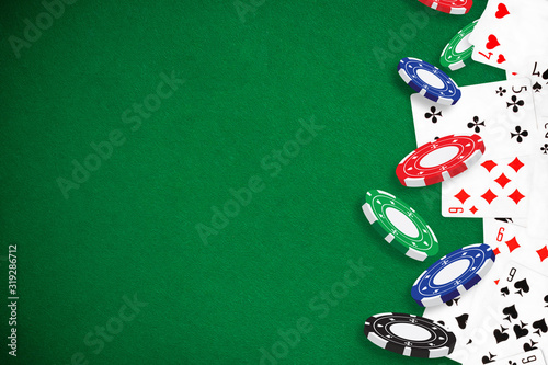 Gambling - Poker playing cards and chips green background