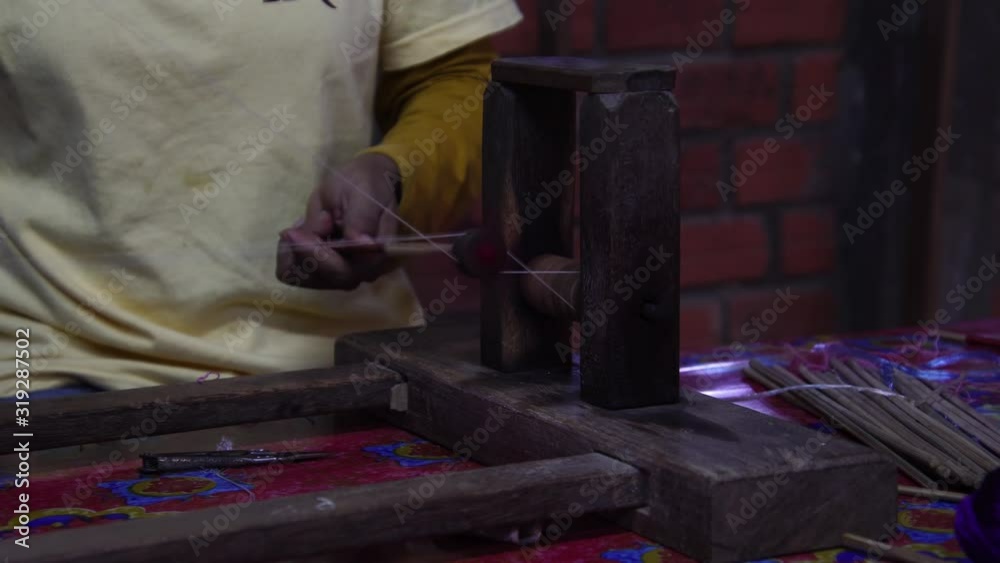 Woman weaving handmade silk clothes. Making silk by hand with traditional tools. Handloom industry. Woman weaving handmade silk clothes. Making silk by hand with traditional tools. Handloom industry.