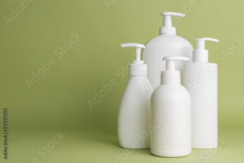 White plastic soap dispensers. Copy space. Place for text.