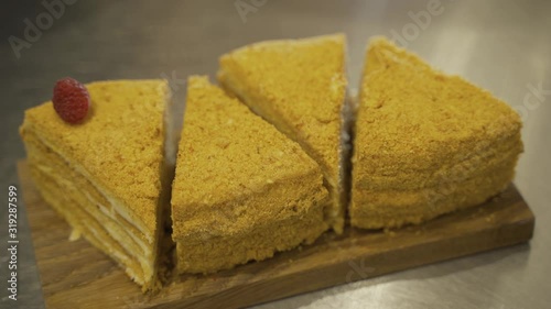 Cake decoration with cream, berries and mint icing sugar. Sweet dessert