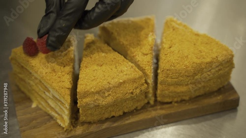 Cake decoration with cream, berries and mint icing sugar. Sweet dessert