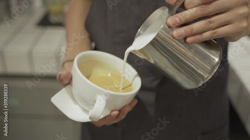 Barista making of cafe latte art, heart shape