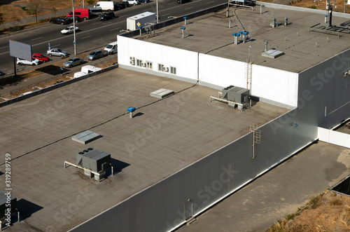 Photography View of the roof of a commercial building in the middle of the city