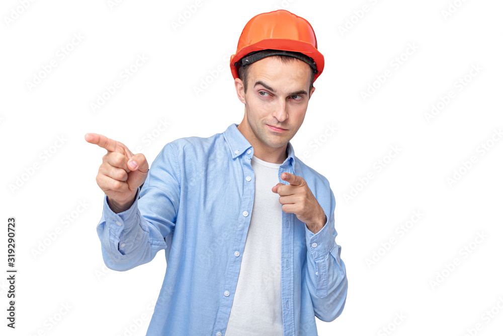Builder in helmet, smiling man and pointing to someone, isolated, background, copy space