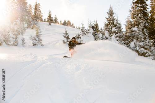 Man gliding from mountain on a professional snowboard
