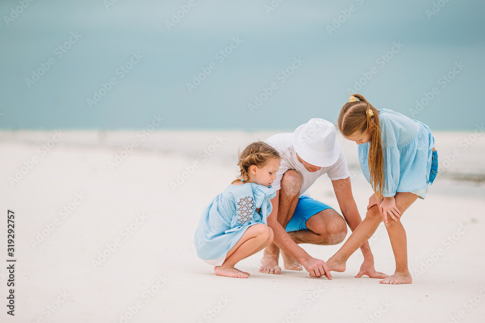 Father and kids enjoying beach summer vacation