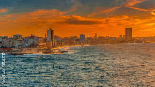 colorful old havana skyline cityscape in the sunset with the melecon and the sea, cuba 