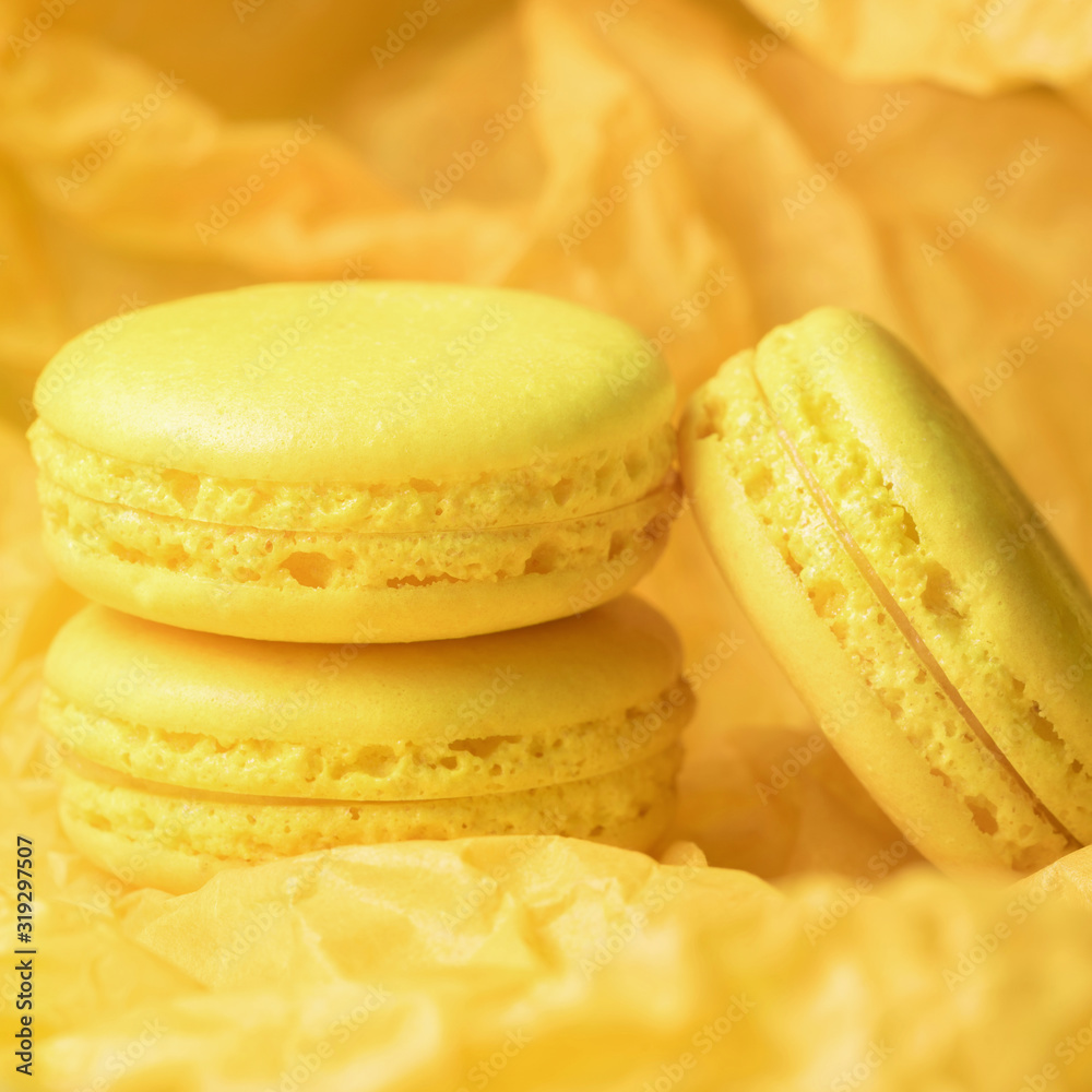 Yellow macaroons on yellow paper tissue. Monochrome Yellow macaroons on yellow paper tissue. Monochrome