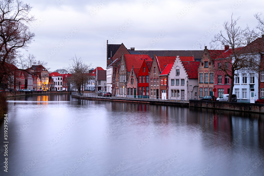 Naklejka premium Buildings in Bruges (Belgium) reflecting in the Water
