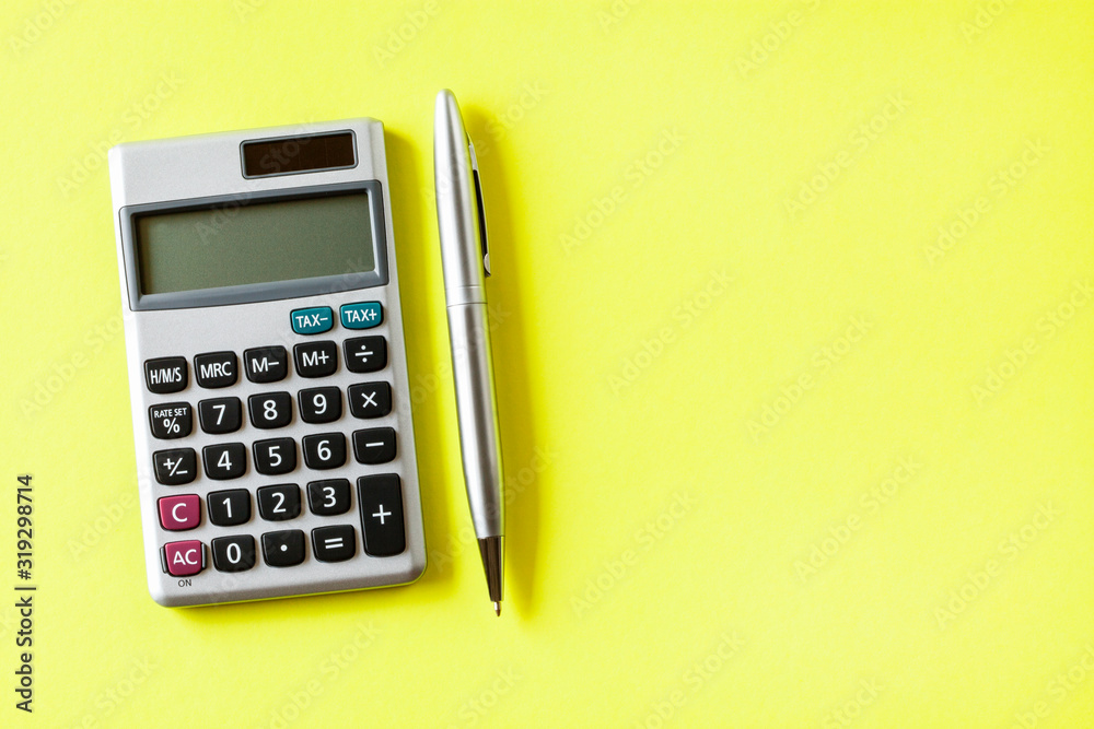 calculator and pen isolated on white background calculator and pen isolated on white background