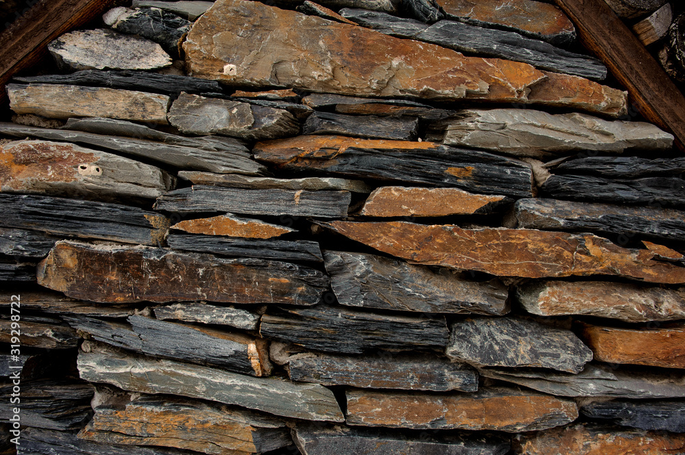 Textured background of the flat stones wall Textured background of the flat stones wall
