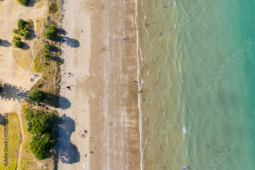 Aerial View of Ocean, Sea, Long Bay, Beach, Soft Colors in Auckland, New Zealand