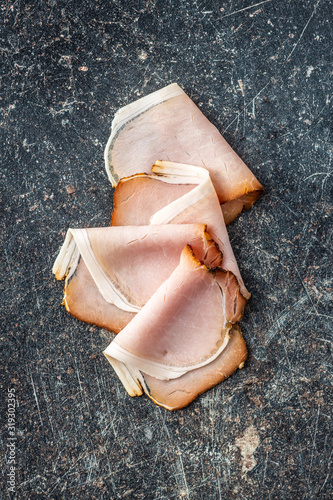 Sliced smoked ham. Tasty pork meat. photo