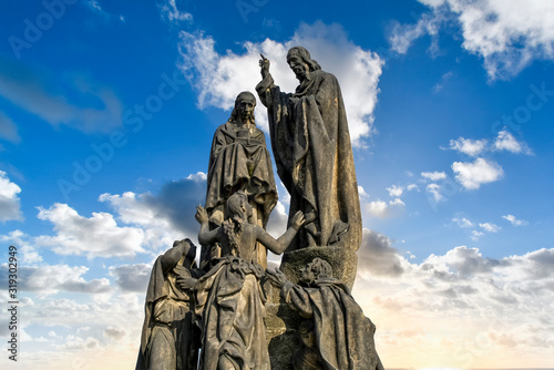 Close up view of the Statue of Saint Cyril and Saint Methodius, one of the many sculptures that run along the Charles Bridge in Prague, Czechia.