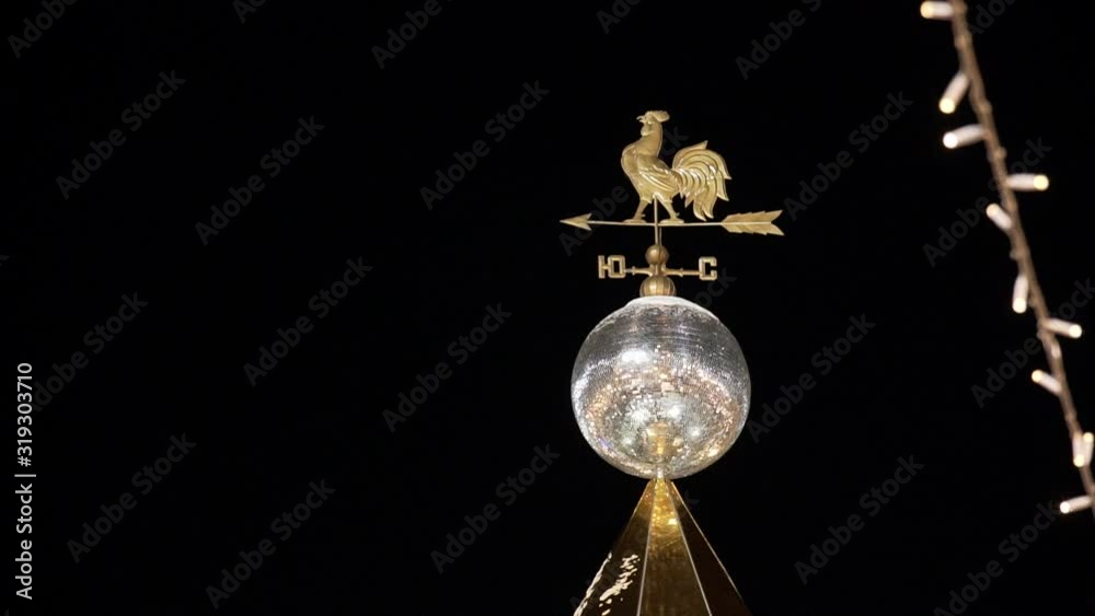 Rooster Weather Vane on a Rooftop